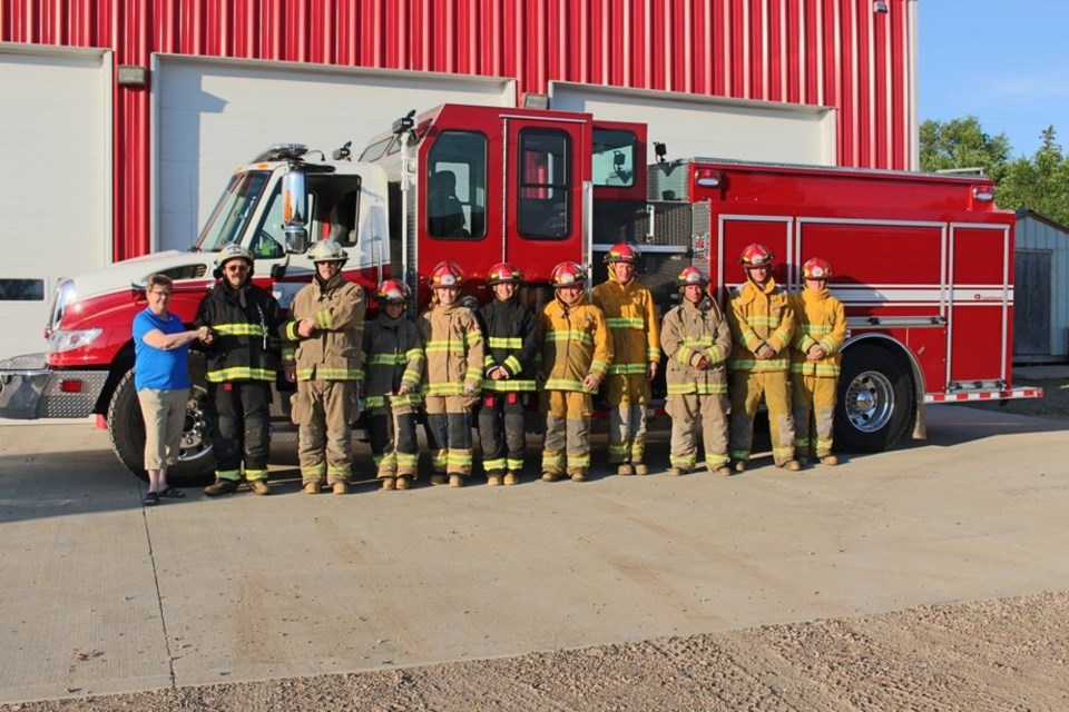 Photographed with Kamsack’s new firetruck, which was received at the end of Junek from left, were: Mayor Nancy Brunt, Chief Ken Thompson; Deputy Chief Bruce Thomsen; Lieut. Kristin Johnson, Delany Murphy (firefighter), Pam Rose (firefighter), Lieut. Larry Planedin, Cameron Rozema(firefighter), Darrell Lomenda (firefighter), Jordan Guenther (firefighter) and Cadet Jordan Green.