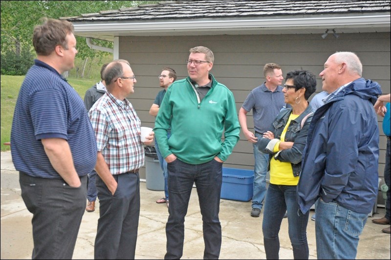 Premier Scott Moe was on hand meeting local residents at a Sask Party barbecue event at the Battlefords River Valley Visitor Centre. North Battleford Mayor Ryan Bater, who works out of the Visitor Centre with Destination Battlefords, was among those who chatted with Moe, Battlefords MLA Herb Cox and Cut Knife-Turtleford MLA Larry Doke. Photos by John Cairns
