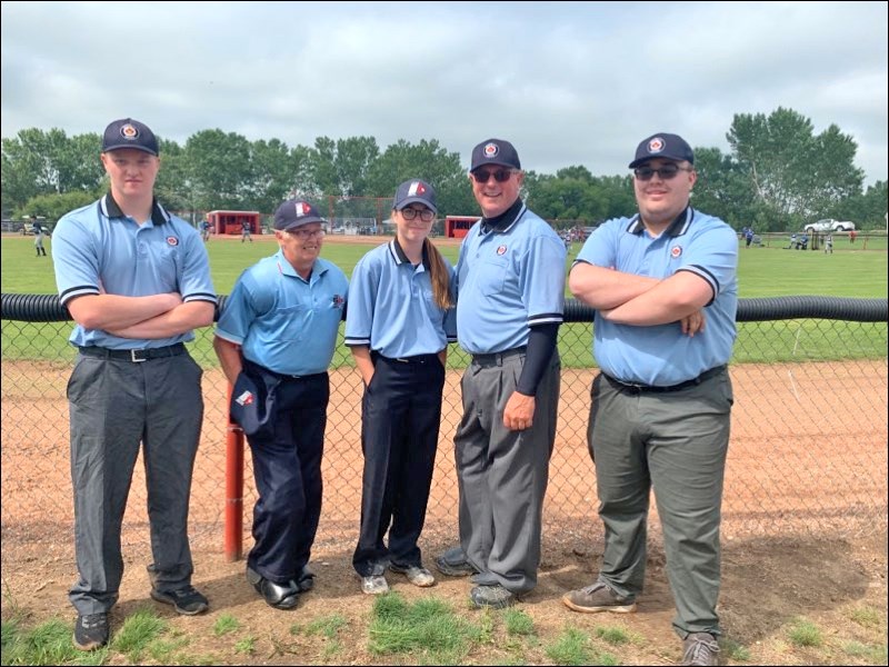 Team Blue is an integral part of championship season in ball. This photo includes umpires who were part of the U14C girls’ provincial softball championship held in Macklin July 19-21: Dawson Wilson, Unity; Marilyn O’Driscoll, Battleford; Gracen Rewerts, Unity; Trevor Green, Unity; Owen Heck, Macklin. Green will be part of Team Blue for U16 Canadian championships being held in Saskatoon July 30 to Aug. 4 while Heck will be part of the umpire team officiating at U16 Western Canadian championship being held in Biggar on the August long weekend. Photo submitted by Sherri Solomko