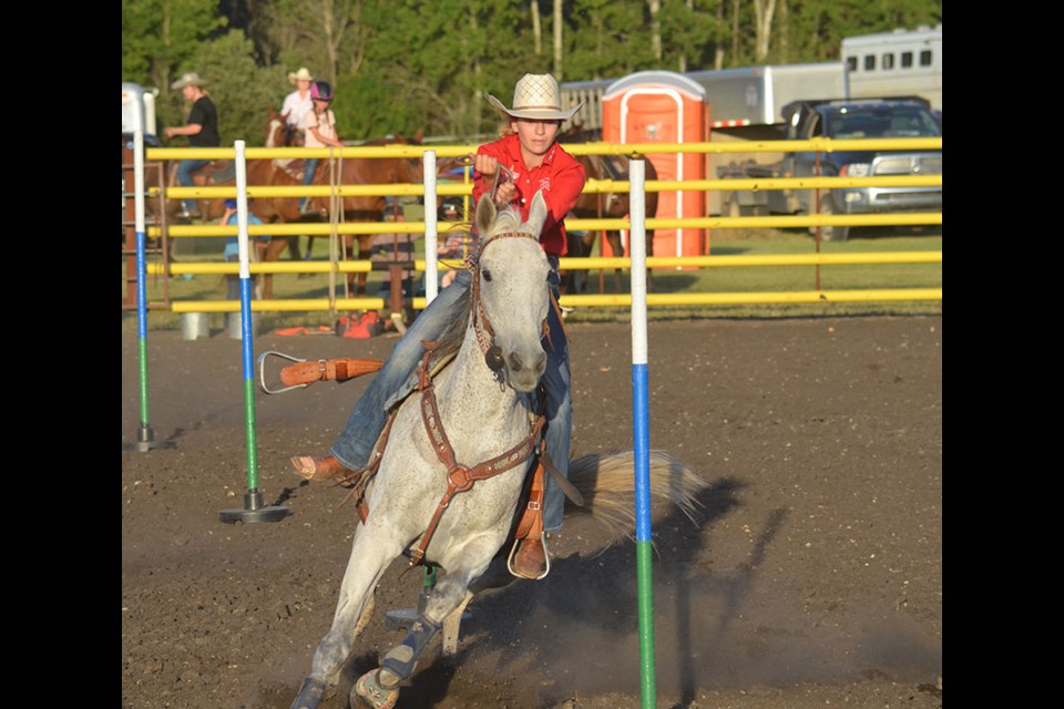 Clara Houff races her horse through the Pole Bending routine at Wawota Heritage Days.