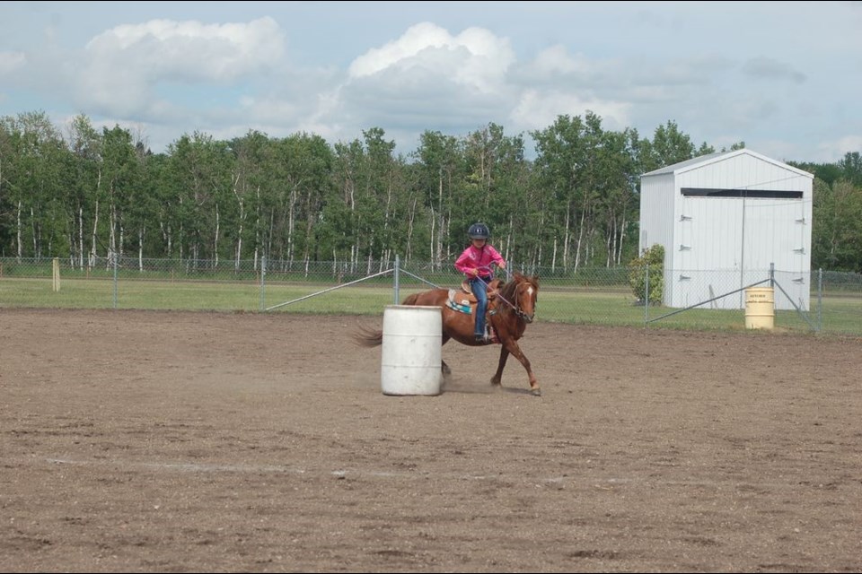Ella Sywenky of Hudson Bay and her horse Sandy made their way around the barrels during the Preeceville Western Weekend gymkhana event on July 13 and 14.