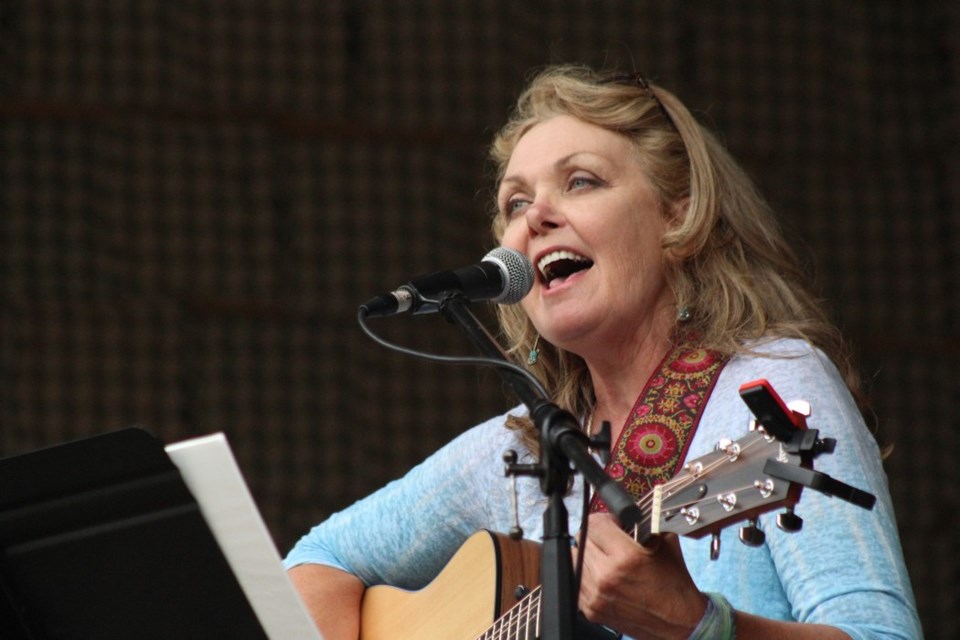 Debbie Tripp played a solo acoustic set. - PHOTO BY ERIC WESTHAVER