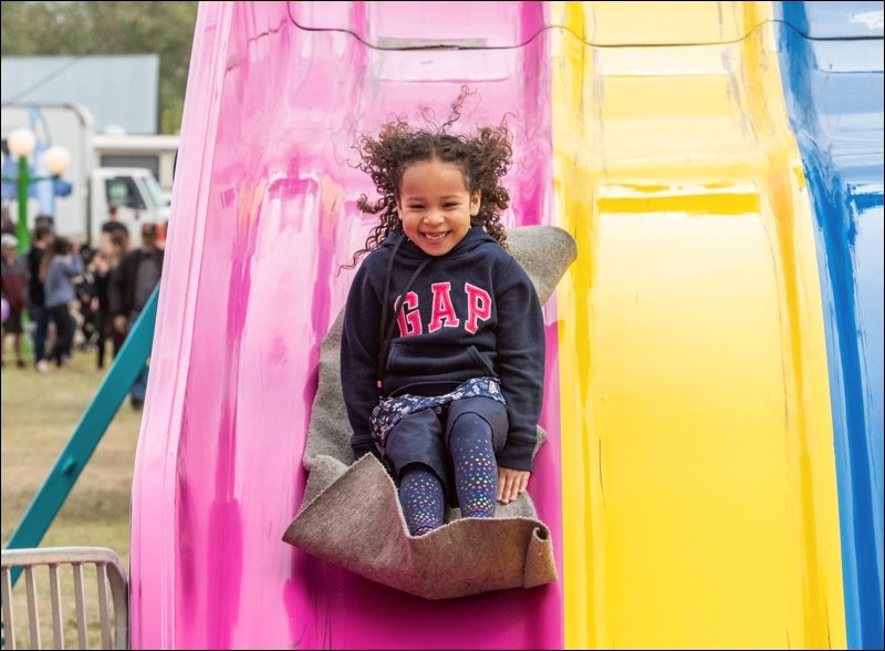 All smiles on the slide.