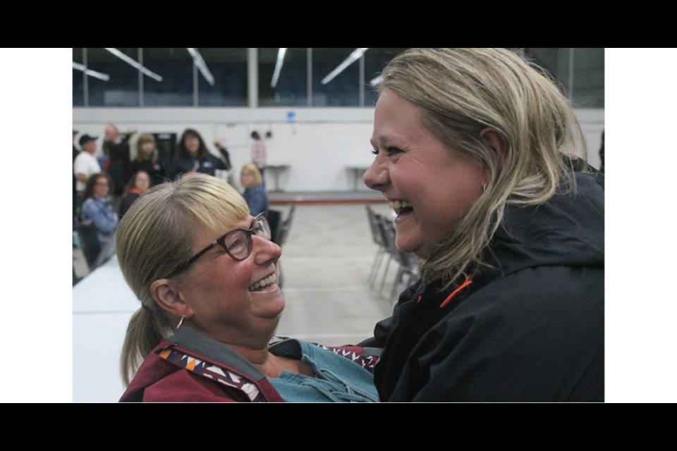 Sisters Deb Jeffers and Heather West embrace, after learning they just won Fish for Freedom. Photo by Jessica R. Durling