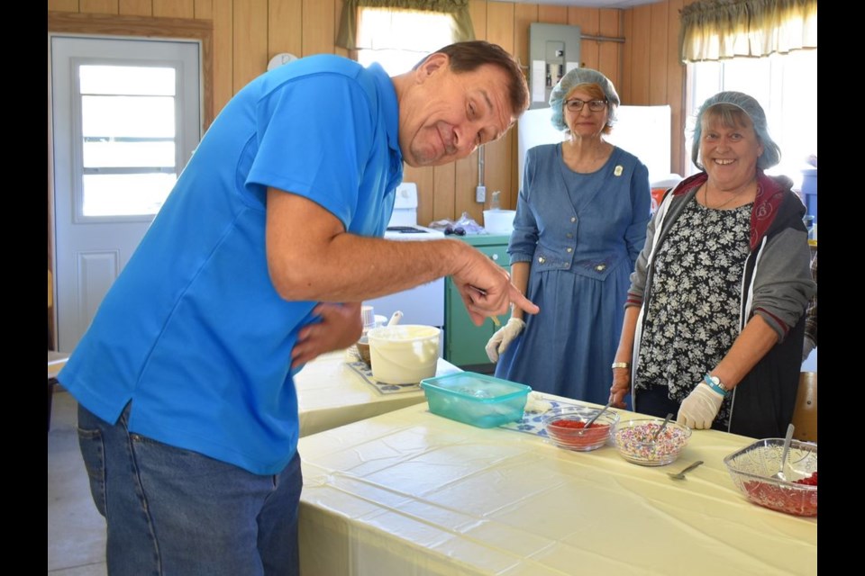 Brad Cherkas of Etobicoke, Ont., was the first person to arrive at the Ice Cream Social event, and he showed his sense of humour as he waited to be served an ice cream sundae with all the fixings.