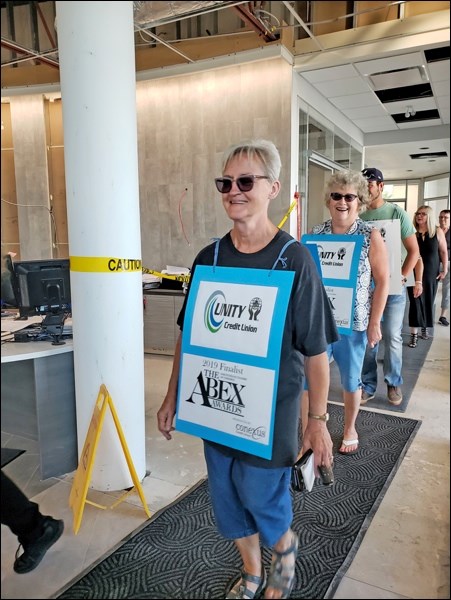 With pomp and circumstance, a parade was led into Unity Credit Union the afternoon of Aug. 20, compl