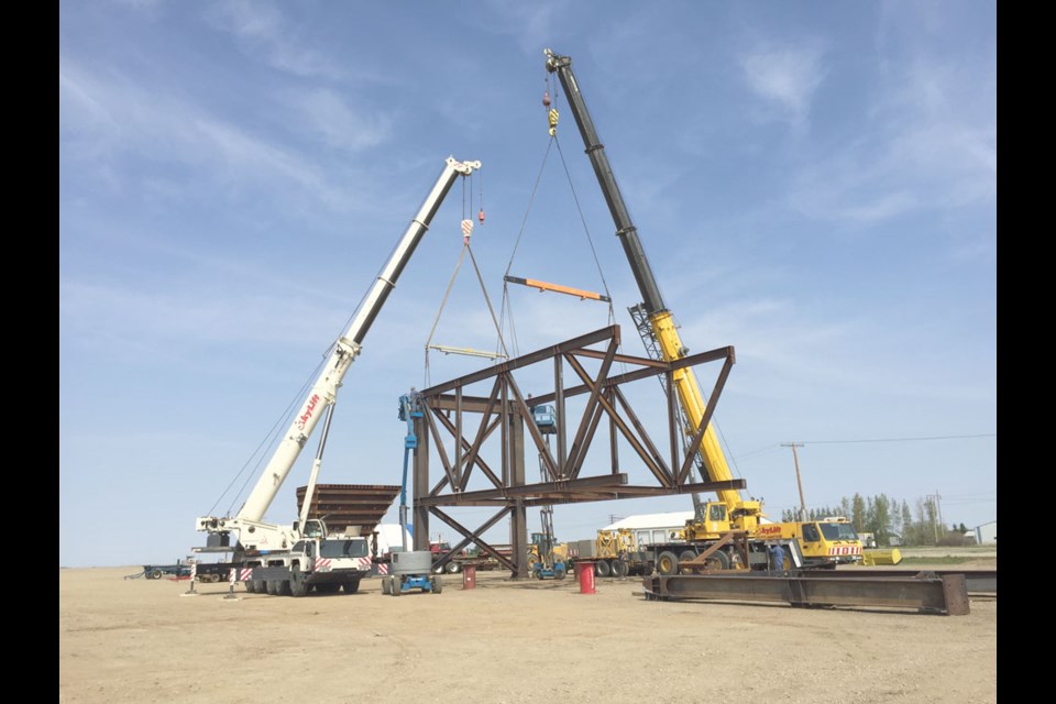 Two cranes from Skylift Services perform a tandem lift. Photo submitted