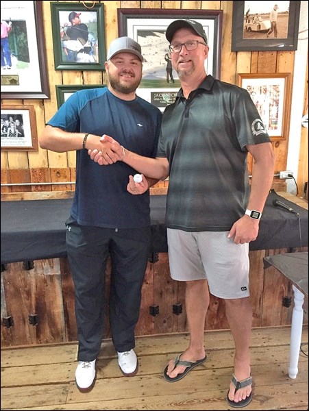 Randy Sharp is congratulated by Pat Mohr on achieving a hole in one on Aug. 24 at the Meota Golf Course. This is the second one at this course this summer. Sharp aced the par three on the seventh hole, from 198 yards, with a five iron. He was playing with Colin Sharp and Vic Kappel and was witnessed by Pat Mohr at the eighth tee off. Photo submitted by Lorna Pearson