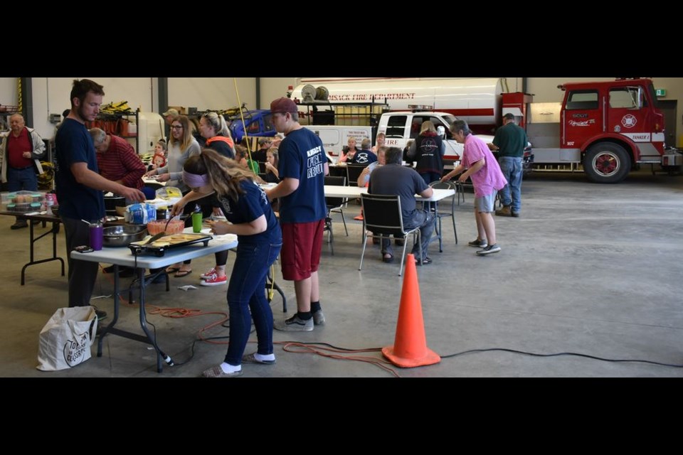 Volunteers cooked and served a pancake and sausage breakfast at the Kamsack Fire Hall on August 24 at an open house event.