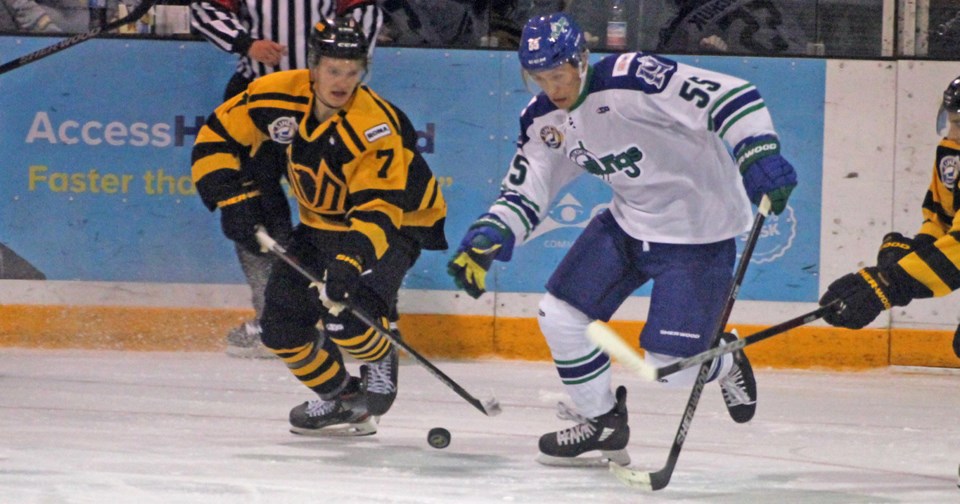 Michael Makarenko of the Nipawin Hawks and Gabe Odowichuk of the Melfort Mustangs