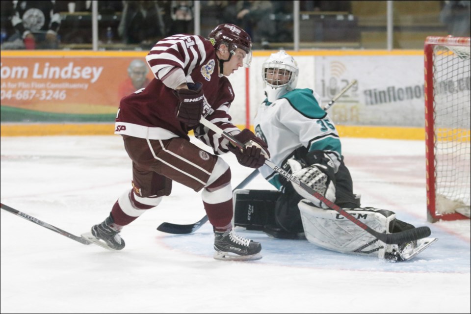 KICK SAVE AND A BEAUTY Flin Flon Bomber forward Matt Flodell gets robbed by the skate of La Ronge goalie Ryan Baker during the Bombers’ home opener at the Whitney Forum Sept. 13. While Flodell wasn’t successful on this play, the Bombers were last weekend, beating La Ronge 5-2 at home and 4-1 on the road Sept. 14. - PHOTO BY KELLY JACOBSON