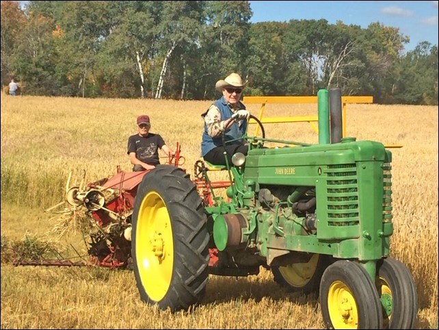 Dave Howe on the JD Row crop tractor pulling the McKormick Deering binder with Ruben Rempel handling the controls in preparation for Borden’s Threshing Day Sept. 28. There will be a parade of power at noon at the site two miles north of Borden. The cook car opens at 10 a.m. and demonstrations start at 1 p.m., including threshing. There will be a roast beef supper in Borden at 4:30 p.m. and the Borden Museum will be open in afternoon. Photo submitted by Lorraine Olinyk