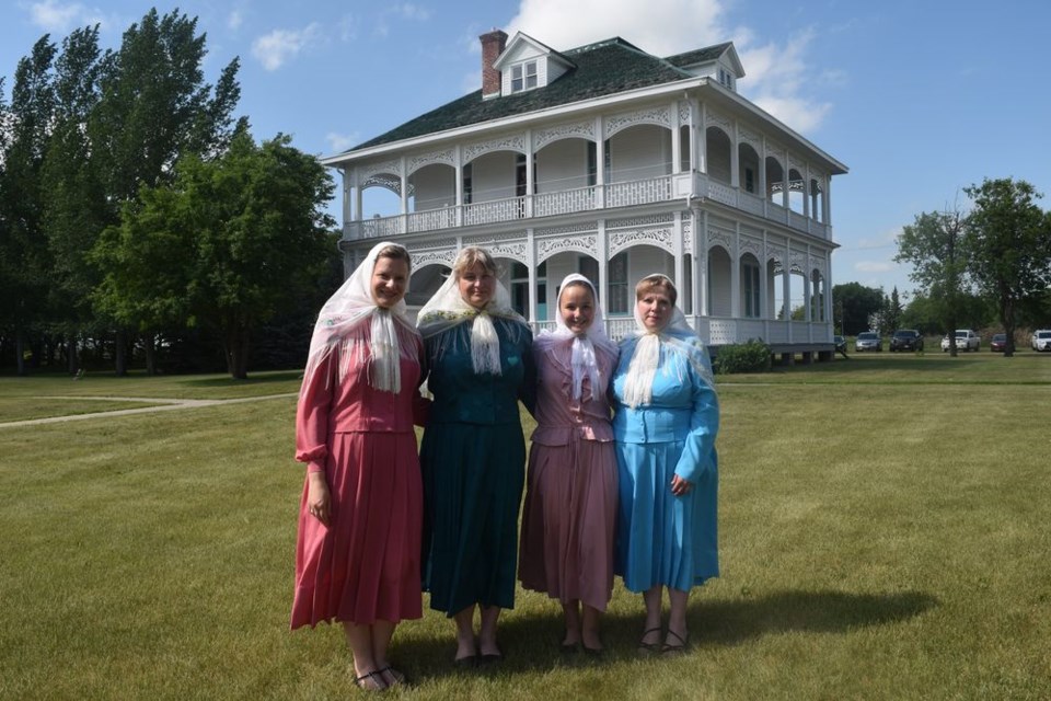 Among the visitors to Veregin on July 14 and 15 when a celebration was held to mark the centennial of the Veregin Prayer Home were members of a British Columbia Doukhobor choir. Members included two sisters and two cousins from Castlegar, who were photographed in front of the Veregin Prayer Home. From left, were: Stefanie Soukeroff, Galena Hudikin, Dawn Hudikin and Valentina Loukianoff.