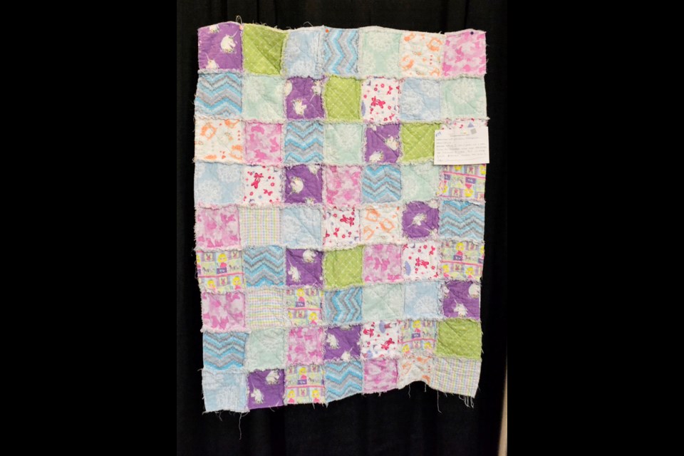 This rag quilt was made by Leighton Thompson, a grade three student at CES. The quilt was from pieces found in her grandmother’s, Bev Thompson, stash.
