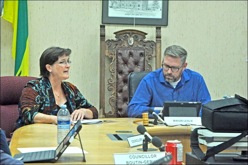 Tammy Donahue Buziak makes a presentation to Mayor Ames Leslie and the rest of town council in Battl