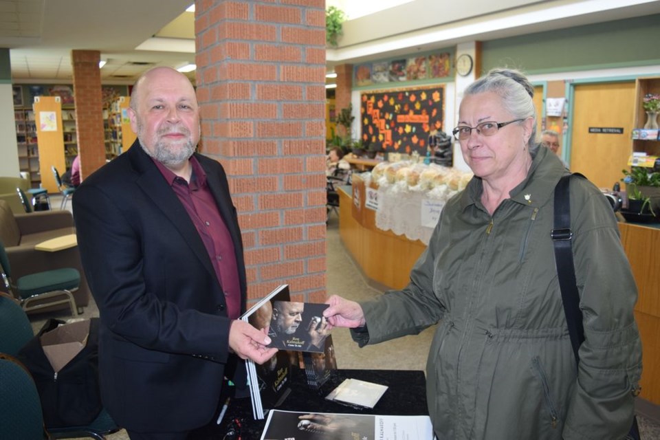 Joan Foreman received a signed CD from Ron Kalmakoff and discussed his deep connections to the Canora area.
