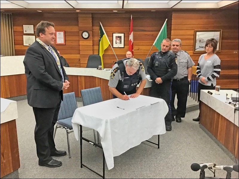 Mayor Ryan Bater, special constables Barry Adams, Jerry Koliniak and Jamie Gabriel and the city’s di