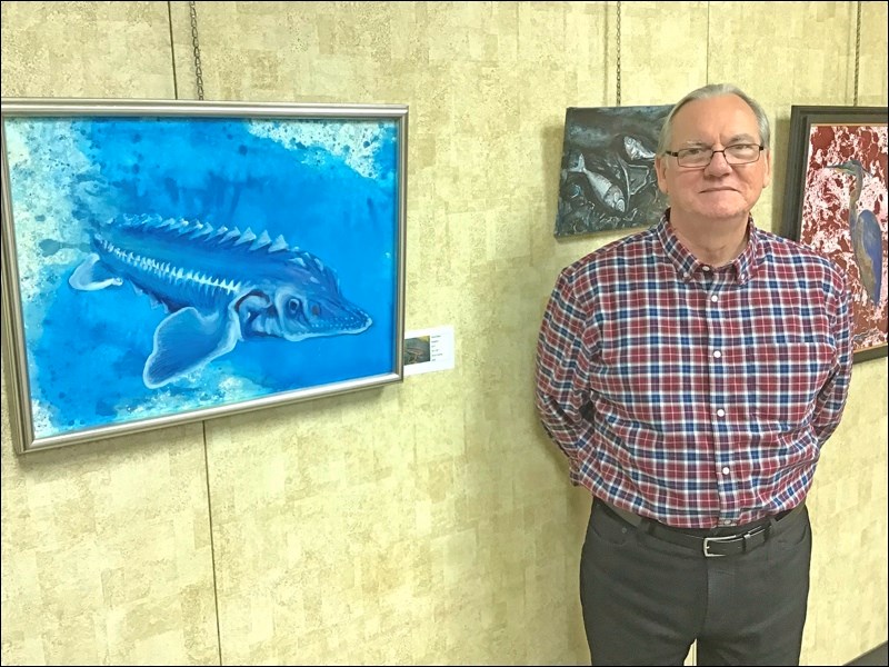 Denis Briere, Métis artist, presents the paintings in his exhibition Maidstone Fossoils at the ARC Creative Studios in North Battleford. The paintings depict the impact of the Husky oil spill on animal life in and along the North Saskatchewan River. Photos by John Cairns