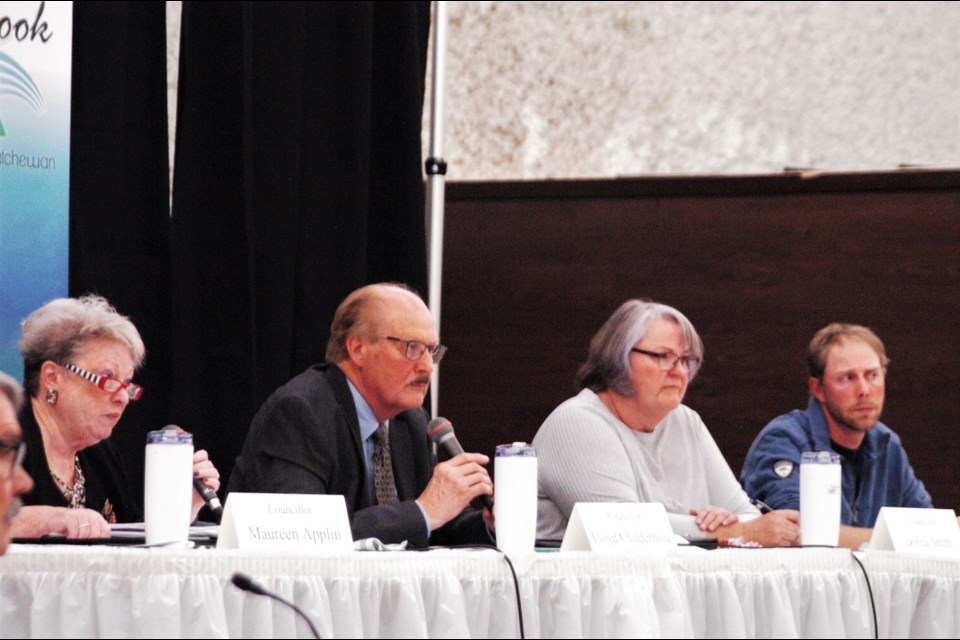 Councillors Maureen Applin, Floyd Childerhose, Donna Smith and Kevin Grotheim listen to comments from residents. Just barely in the frame to the left is meeting moderator, Laurie Tollefson.