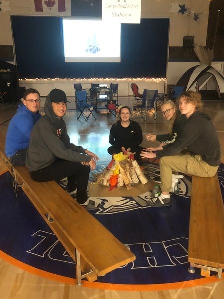 Sturgis Composite School students who sat around a campfire built in the gym for family literacy night during education week on October 24, from left, were: Shae Peterson, Keannu Albarracin, Kylie Babiuk, Shanae Olson and Tate Bayer.