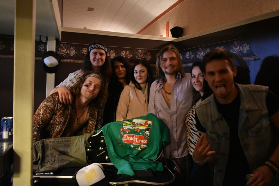 From centre left, Baylee Foster and Catherine Maksymetz of Kamsack posed with members of Dead Levee on Saturday night.