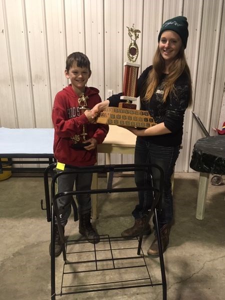 Tristen Beatty, left, received a trophy for high point winner during the Etoimamie Valley Riders Club trail ride and awards on October 26. Ronda Palaniuk made the presentation.