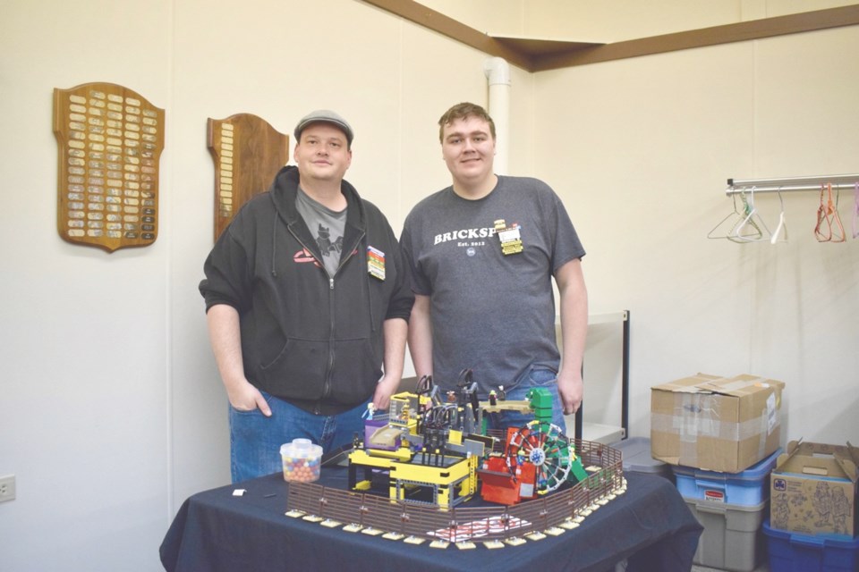 Colby Goss, left, and Cooper Monroe along with a few other Lego constructors built a Great Ball Contraption, which was on display at the Brickery in Estevan. Photo by Anastasiia Bykhovskaia