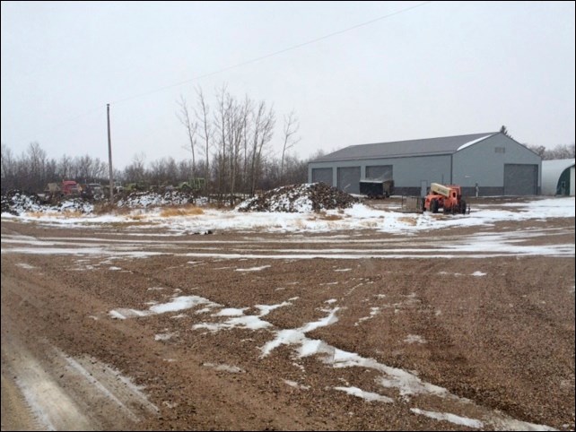 A photo of the new RM maintenance shop in Mayfair and the heavy equipment sitting nearby on a dreary
