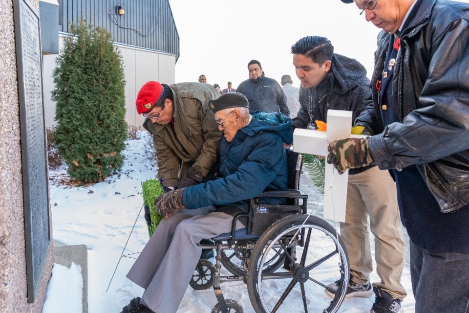 Phillip Favel, Second World War veteran, lays a wreath at the Veterans Monument outside of the Gold Eagle Casino.