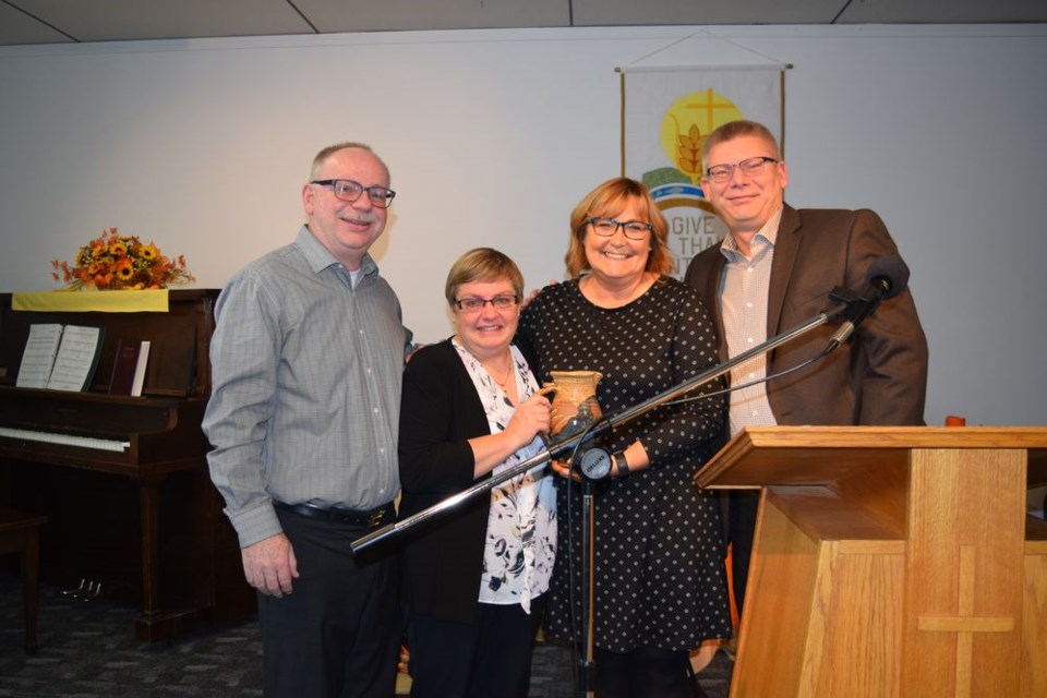 A quarter century of ministry in Canora by Pastor Greg and Carolyn Bright was celebrated during a service at Gateway Community Church on November 3. From left, were: Greg, Carolyn, and Janine and Phil Gunther, director of ministries for the Saskatchewan conference of Mennonite Brethren Churches. The Gunthers presented Greg and Carolyn with a ceramic pitcher, symbolic of spiritual outpouring.