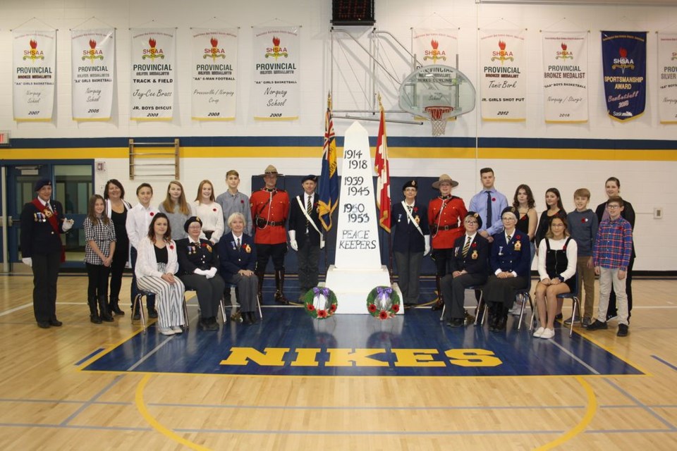 Norquay School Students, along with members of the Norquay Royal Canadian Legion and RCMP held a Remembrance Day Service at the school on Friday morning. From left, were: (back) Geneveve Galay, Jordyn Seversen, Jeannette Ebert, Jaxson Lindgren, Tessa Reine, Randi Foster, Micah Johnson, Trevor Pieterse, Jeremi Korpusik, Barb Fraser, Ellen Ruf, Jayden Heskin, Ella Foster, Kortny Wasylyniuk, Carson Ebert, Jack Korpusik and Nichole Grocholski and (front) Emily Livingstone, Denise McGonigal, Laura Dahl, Jackie Polowich, Tricia Challoner and Haylie Desjarlais.