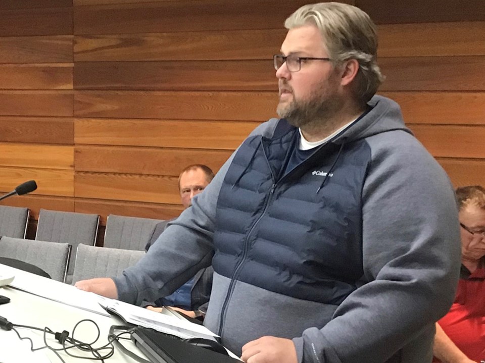 Dallan Oberg speaks at a North Battleford city council meeting Tuesday in support of a proposed rezo
