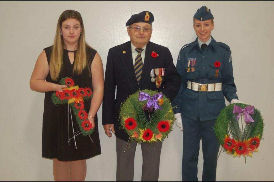 Individuals who laid a wreath, from left, were: Camryn Nelson, Larry Larrivee and Almina Kovcic. Leslea Hanson also laid a wreath but was unavailable for the photograph.
