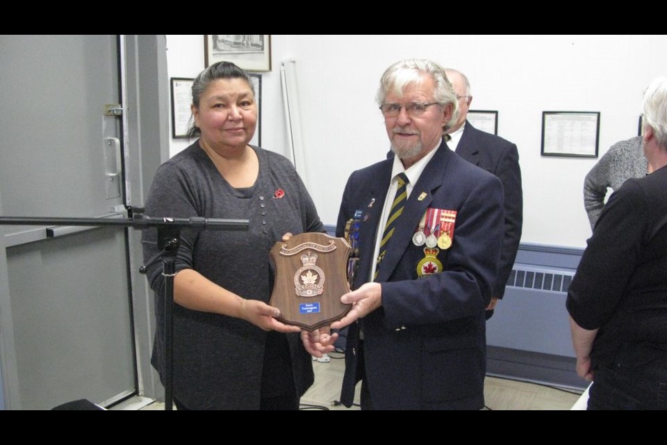 Jim Woodward presented Karen Tourangeau with the Legionnaire of the Year plaque for 2019.