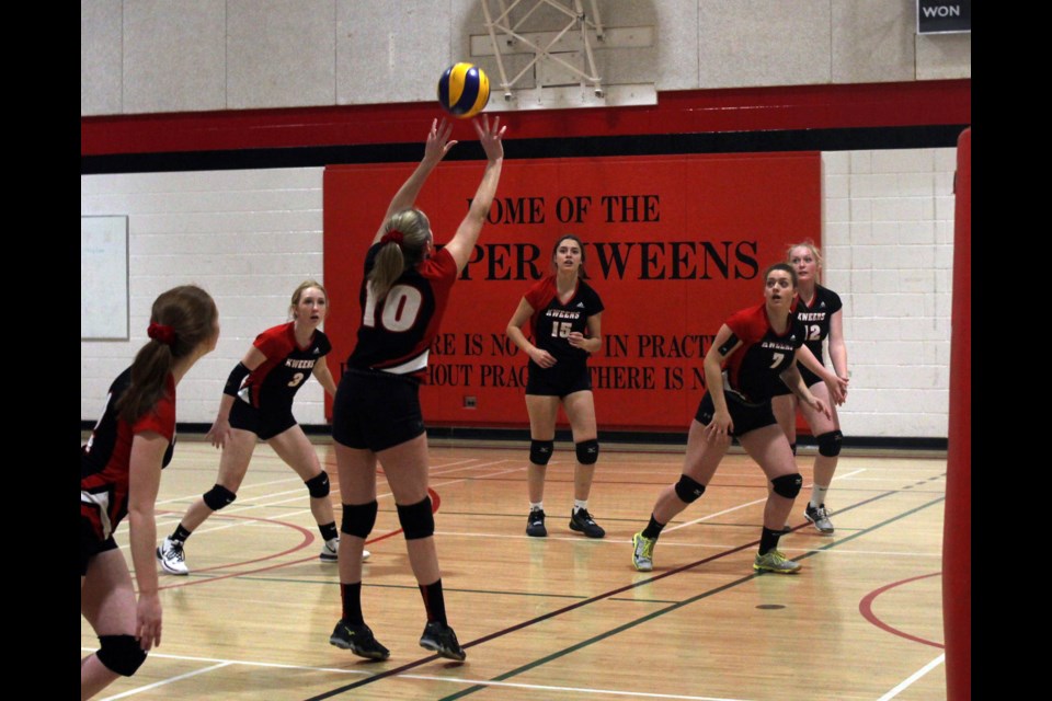 Maryn McKee sets the ball for one of her teammates during the Zone 11 volleyball tournament at Hapnot Collegiate. The Hapnot Kweens took home the banner and will move on to provincials. - PHOTO BY CASSIDY DANKOCHIK