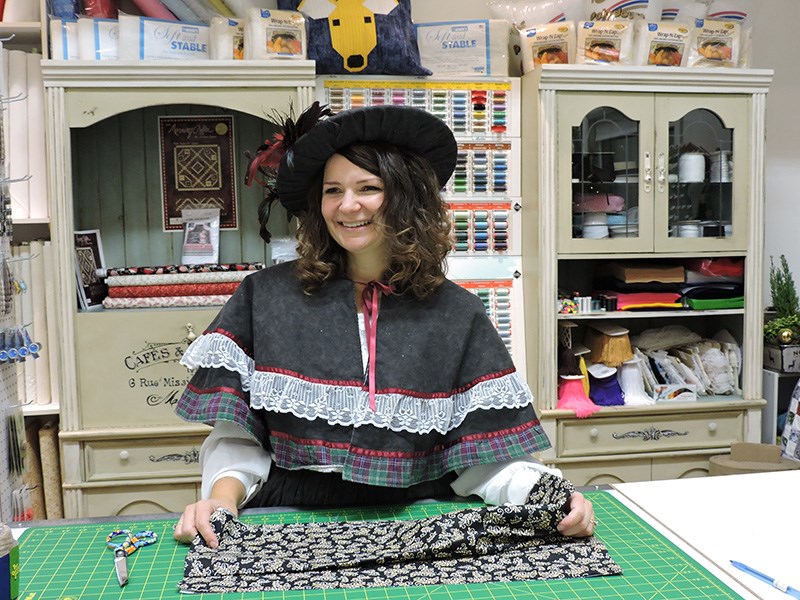 Tanya Robertson, owner of Sew & Sews in Carlyle, dresses the part for the annual Dickens Festival.