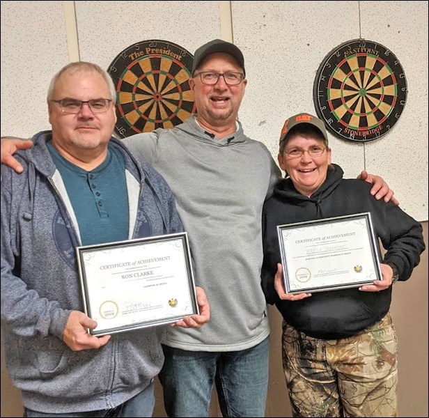 Ron Clarke and Teresa Ducharme accepting their award from Meota Curling Club Darts Night tournament