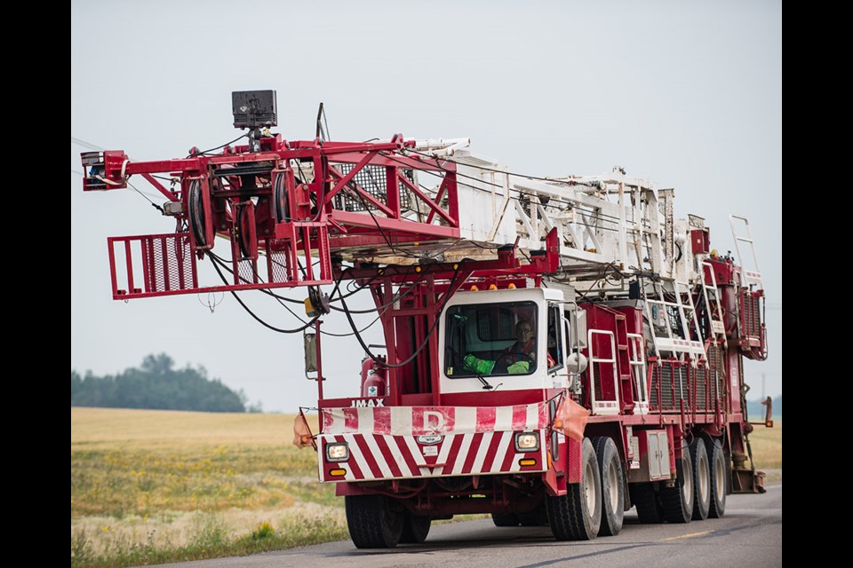 Jmax Well Service Ltd. is a division of Classic Oilfield Service Ltd. of Lloydminster, with Rig 1 seen rolling down the road north of Lashburn in August 2018.