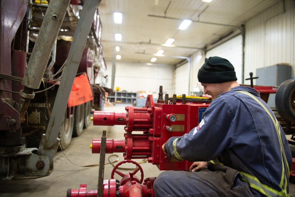 Nick Rutledge works on a BOPS in the Sun Country Well Servicing Shop.