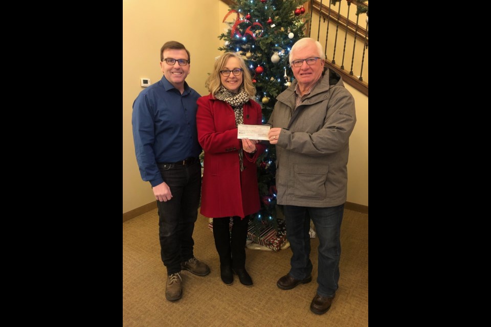 Yorkton Antique Auto Association president Ron Blommaert presented a cheque in the amount of $250.00 to Greg & Leone Ottenbreit for Close Cuts for Cancer.