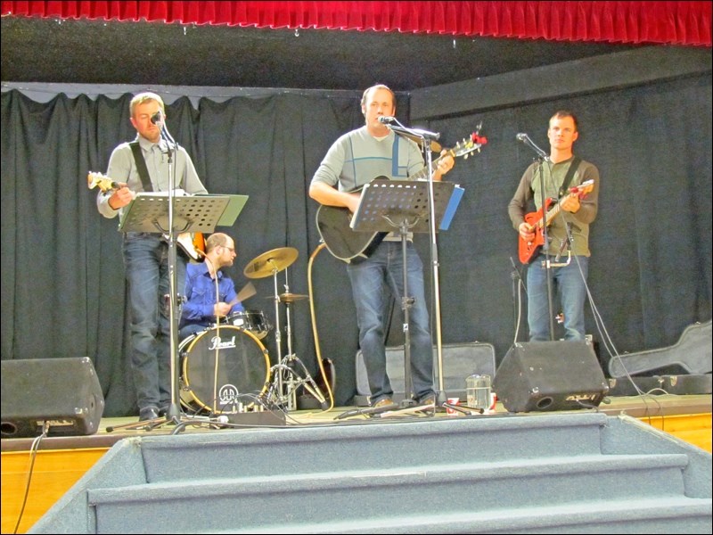 Back 40 – David Froese, Steven Hamm, Martin Guenther and Andy Hamm – entertaining at Borden the Borden Friendship Club supper Dec. 4.