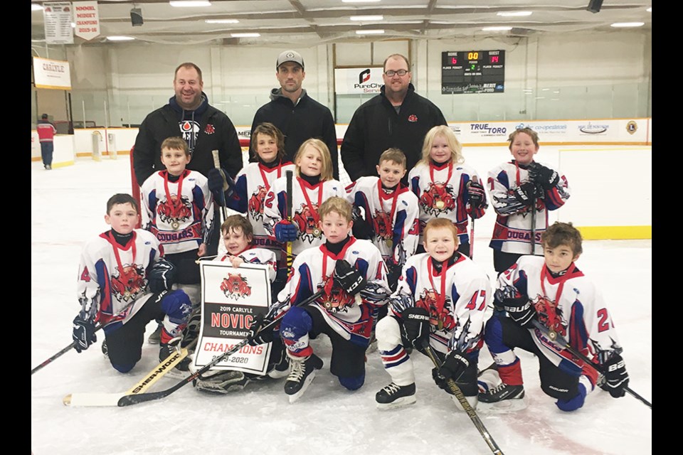 The Carlyle Novice Cougars teams co-hosted their annual tournament on Dec. 7 and 8. The Novice Cougars 1 (Chris) team went undefeated over the two days and were gold medal champs. Back row (L-R): Chris Light, Joey Eaton, Jeff Faver. Middle row (L-R): Jordan Hewitt, Owen Light, Hayden Puskas, Reed Coffey, Payton Faber, Xander Brown. Front row (L-R): Griffin Eaton, Nik Brown, Nash Faber, Brody Knelson, Keenan Winkler.