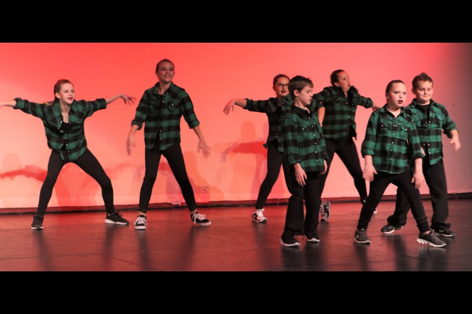 The Extravadance Studio Christmas Squad perform a hip hop dance; Grinch 2000. The group includes Brecklyn Baluk, Kingsley Herman, Callie Hodgins, Keegan Karcha, Alexi Magnusson, Skylar Magnusson and Elizabeth Zawada.
