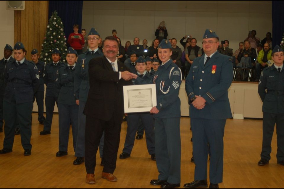 The 606 Preeceville Harvard Royal Canadian Air Cadet Squadron was presented the Top Air Cadet Squadron in a special ceremony. Saskatchewan’s Provincial Military Liaison, MLA Greg Lawrence, presented the Premier’s Commendation of Achievement certificate and pins to each cadet at the Preeceville Legion Hall on December 11. From left, were: Lawrence, Flight Sergeant Almina Kovcic and Captain Troy Rogowski.