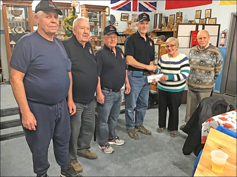 Seen here are Elks John Gamble, Zonie Krawchuk, Ken McKay and Mark Danczak, with CEO Jane Shury (accepting the cheque) and Gil Bellavance.