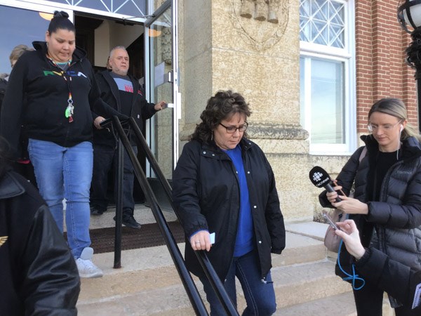 Carol Laverdiere, mother of Tiki Laverdiere, leaves the court house. Photo by John Cairns