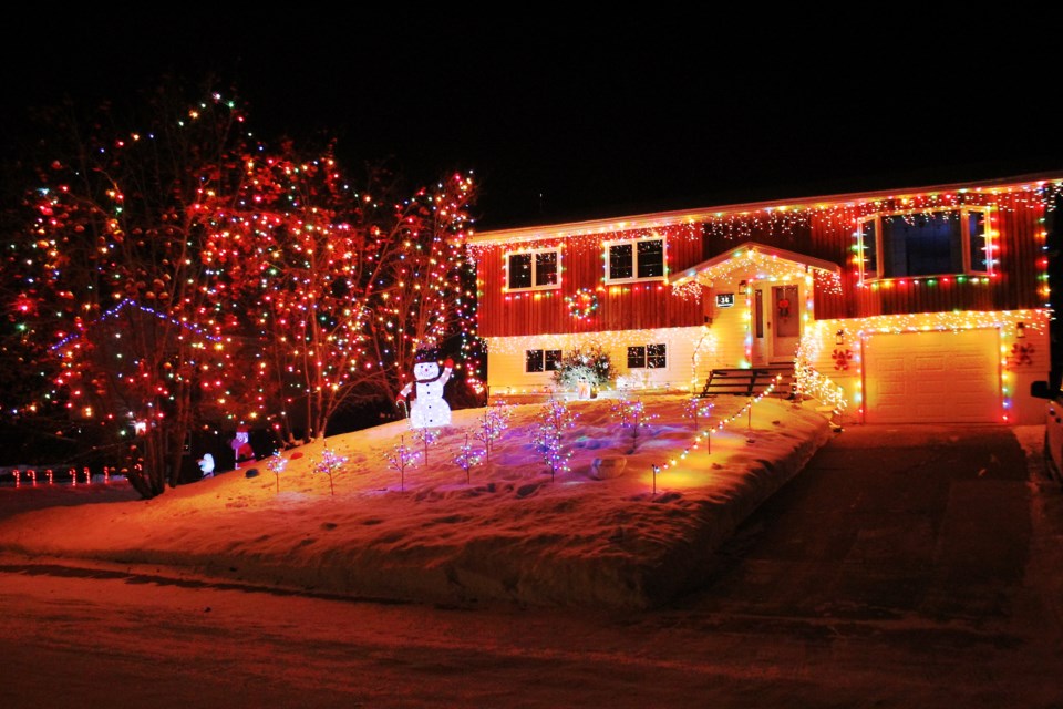 For the past three decades, the home of Garry and Shelley Wallaker has become a holiday haven with one of Flin Flon’s most intricate and large-scale Christmas light shows. - PHOTO BY ERIC WESTHAVER