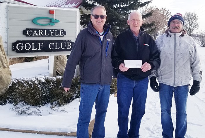 Jack Wilson (centre), representing the Bear Claw Community Development Corp., presents a cheque to members of the Carlyle Golf Club - Secretary Gord Paulley (left) and Manager Martin Tourand. This donation will assist in the installation of new carpet in the Clubhouse.