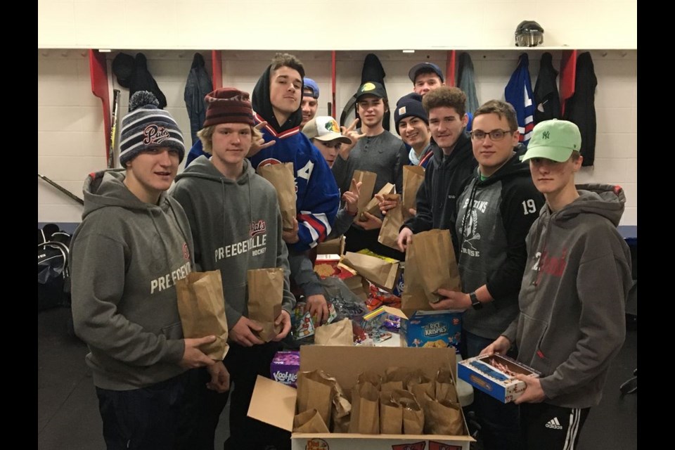 Preeceville Pats midget players who helped fill treat bags for younger players, from left, were: Grady Wolkowski, Shelby Wallin, Brett Smith, Jacob Danyluk, Carter Masley, Ryan Bear, Elijah Hort, Dylan Wiwcharuk, Seth Hort, Shae Peterson and Todd Pankratz.