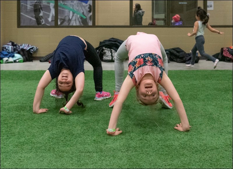 Here, Bela Floen and Georgia Penner show how they can do a bridge.